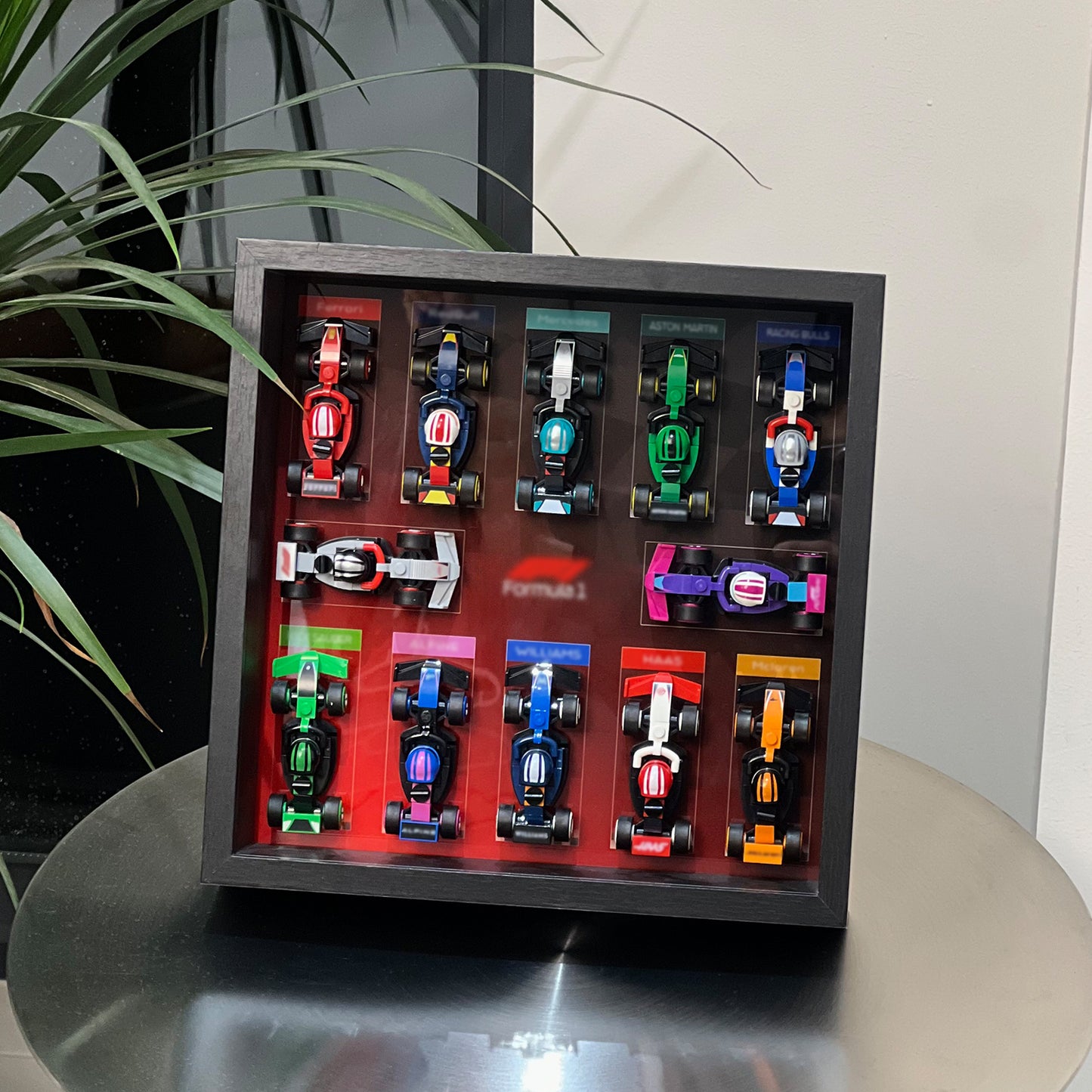 iLuane Display Wallboard for Lego Surprise F1 Collectible Race Cars 66796, Holds 12 Cars on One Frame, Adult Collectibles F1 Wall Mount, Home or Office Décor, Black (No Car Included)